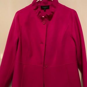 Bright pinkish burgundy coat.